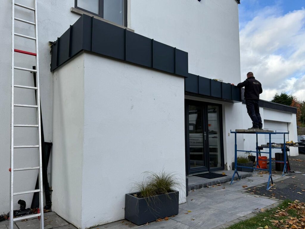 Front porch in Newtownabbey - larger area still to do on this one. Strata Waterproofing PVC single ply top and Prefa aluminium anthracite standing seam panels