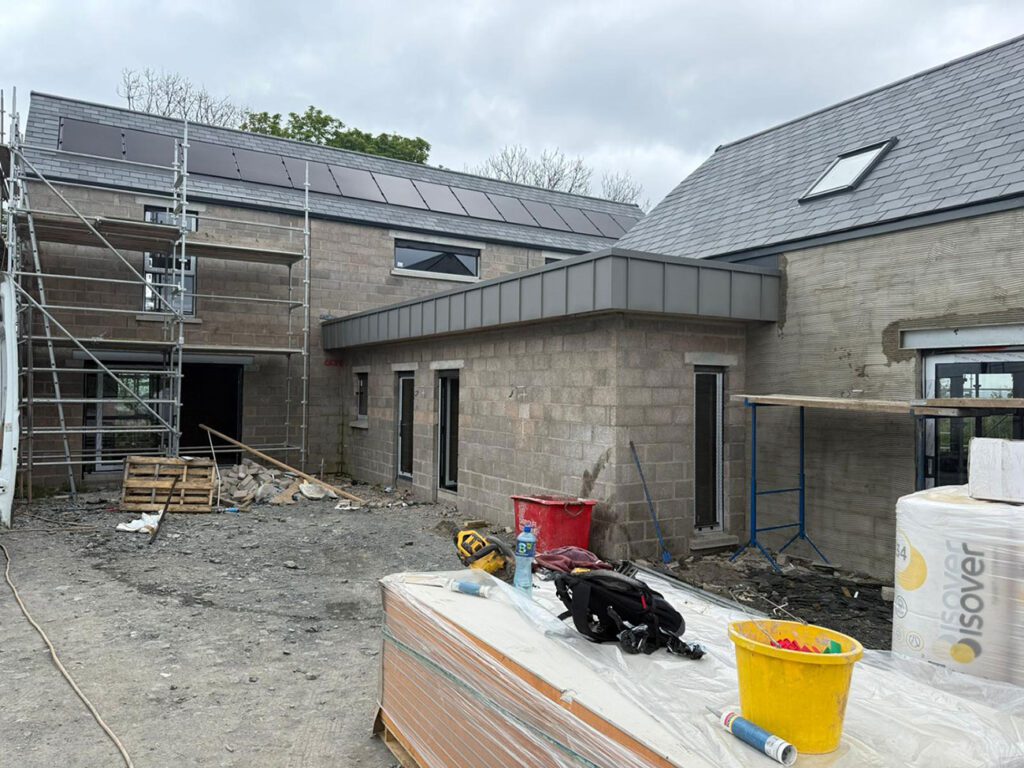 House done in Drumbo with a 90m2 strata waterproofing PVC single ply roof then wrapped with elzinc slate standing seam panels.