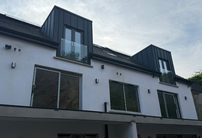 Strata waterproofing PVC single ply on 4 dormers tops and a rear balcony. Dormers then wrapped with Prefa anthracite aluminium standing seam cladding.