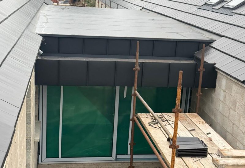 Job in Ballynahinch with Strata waterproofing PVC single ply roof then wrapped with black elzinc aluminium standing seam panels